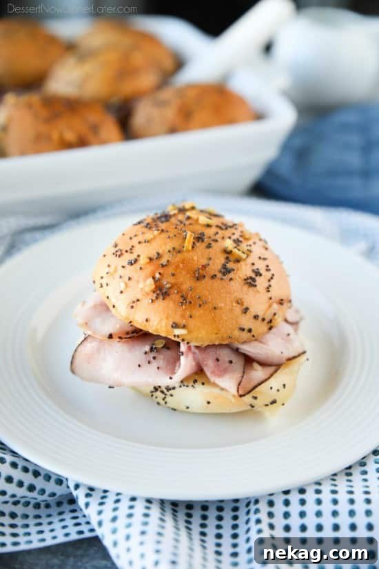 Ham and Cheese Sliders are baked in the oven with a buttery honey-mustard topping. Use leftover Christmas ham, or make them for dinner or game night. They're fast, easy, and feed a crowd!