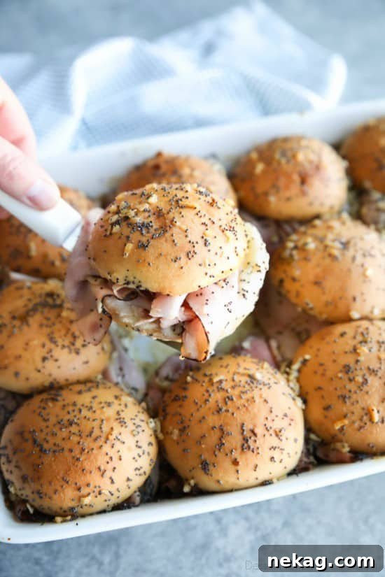 Ham and Cheese Sliders are baked in the oven with a buttery honey-mustard topping. Use leftover Christmas ham, or make them for dinner or game night. They're fast, easy, and feed a crowd!