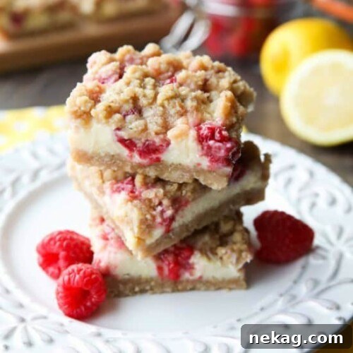Lemon Raspberry Crumb Bars have a creamy and tangy-sweet filling sandwiched between a brown sugar and oat crust that doubles as the crumb topping. These dessert bars are to die for!