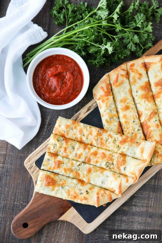 Garlic Cheese Breadsticks Recipe for Crispy, Pull-Apart Delight 2 These easy Cheesy Garlic Breadsticks are loaded with garlic, cheese, and herbs for a great tasting breadstick to enjoy for pizza night. Also delicious dipped in marinara sauce!