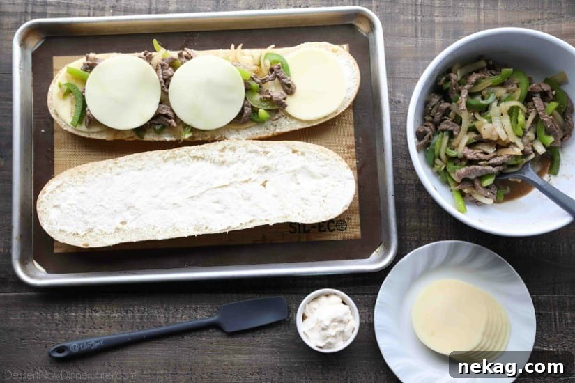 Philly Cheesesteak French Bread is a delicious open-faced sandwich with plenty of juicy meat, crisp veggies, and melty cheese for an easy dinner that is sure to satisfy!