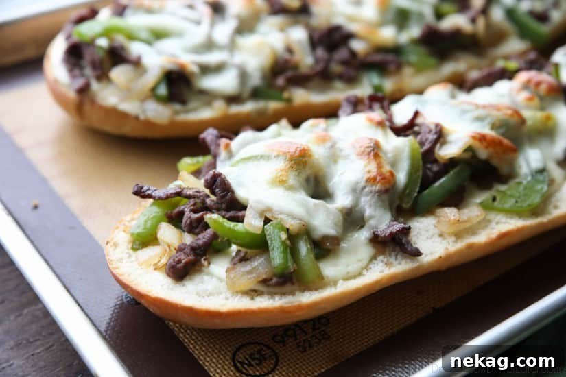 Philly Cheesesteak French Bread is a delicious open-faced sandwich with plenty of juicy meat, crisp veggies, and melty cheese for an easy dinner that is sure to satisfy!