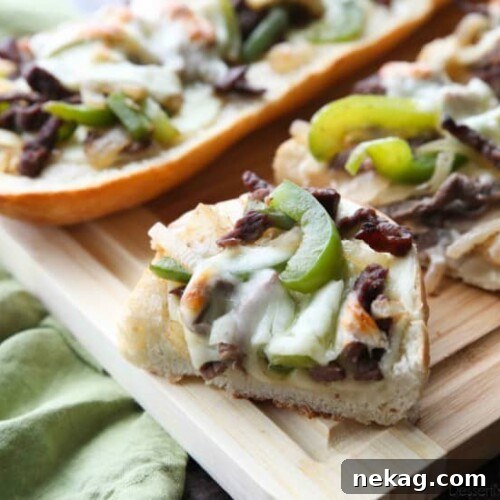 Philly Cheesesteak French Bread is a delicious open-faced sandwich with plenty of juicy meat, crisp veggies, and melty cheese for an easy dinner that is sure to satisfy!