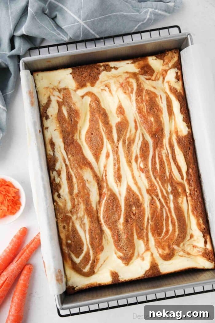 Pan of swirled carrot cake and cheesecake baked together.