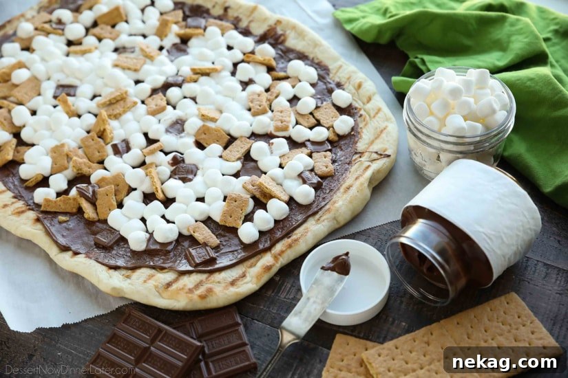 Make your dessert outside! This Grilled S'mores Pizza is an easy and delicious dessert with all the flavors of everyone's favorite campfire treat!
