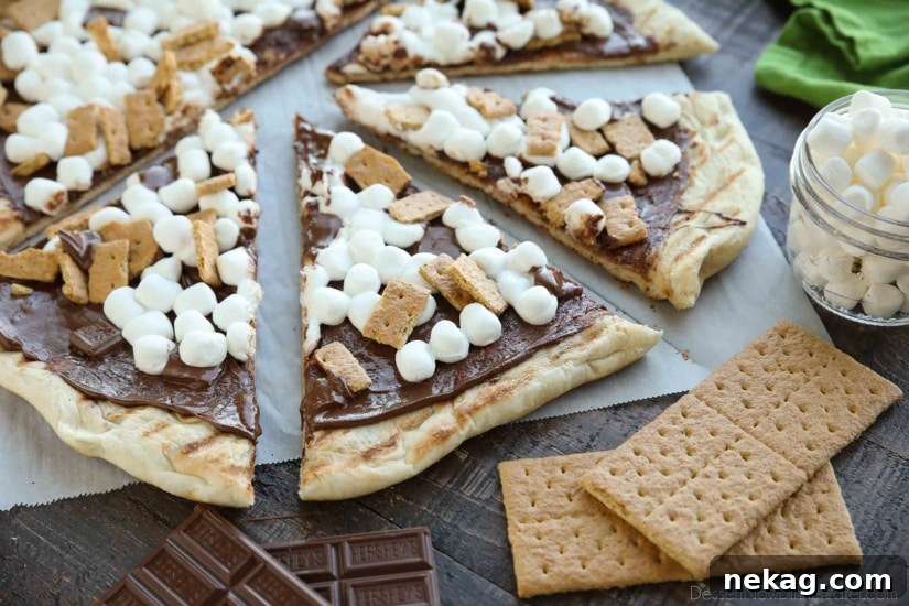 Make your dessert outside! This Grilled S'mores Pizza is an easy and delicious dessert with all the flavors of everyone's favorite campfire treat!