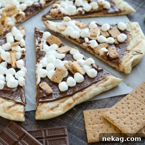 Make your dessert outside! This Grilled S'mores Pizza is an easy and delicious dessert with all the flavors of everyone's favorite campfire treat!