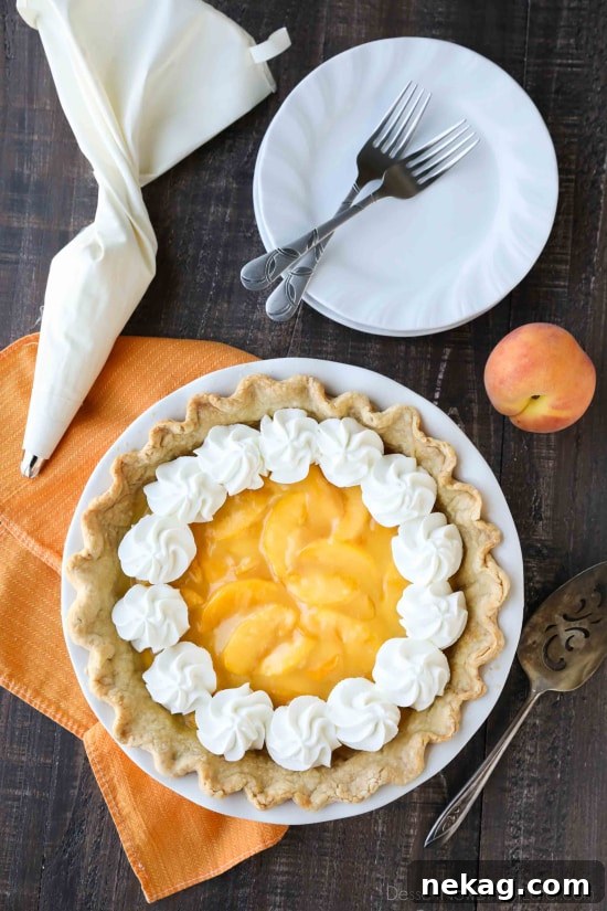 This Fresh Peach Pie has a no-bake filling that uses fresh, uncooked peaches and a simple homemade glaze inside of a crisp pie crust. A great recipe for fresh peaches!