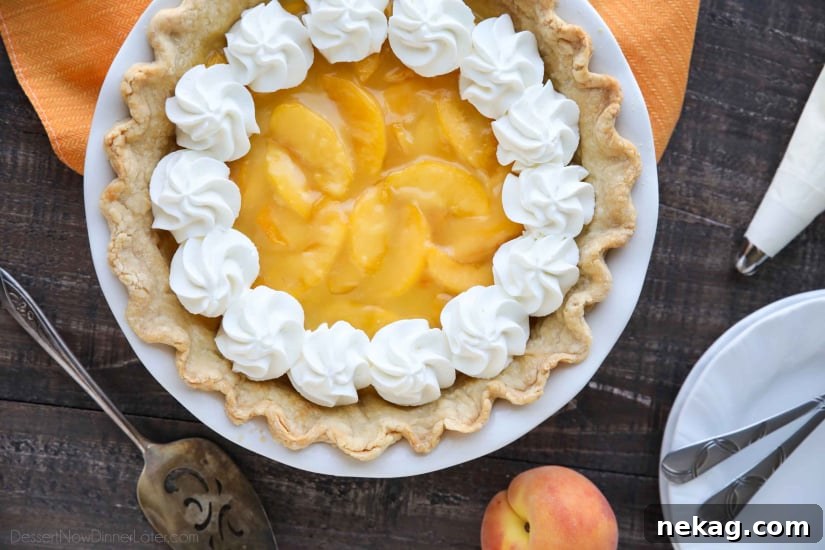 This Fresh Peach Pie has a no-bake filling that uses fresh, uncooked peaches and a simple homemade glaze inside of a crisp pie crust. A great recipe for fresh peaches!