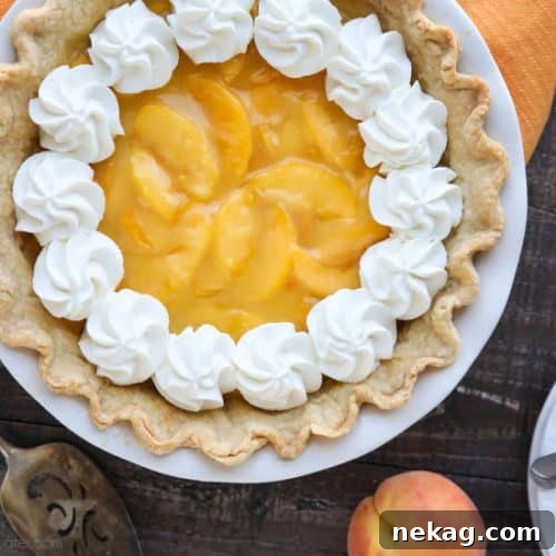 This Fresh Peach Pie has a no-bake filling that uses fresh, uncooked peaches and a simple homemade glaze inside of a crisp pie crust. A great recipe for fresh peaches!