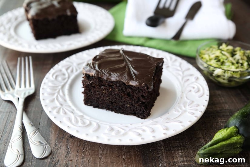 Chocolate Zucchini Cake is rich and moist, and topped with a decadent chocolate frosting. You'd never know there was zucchini hidden in this easy and delicious chocolate cake!