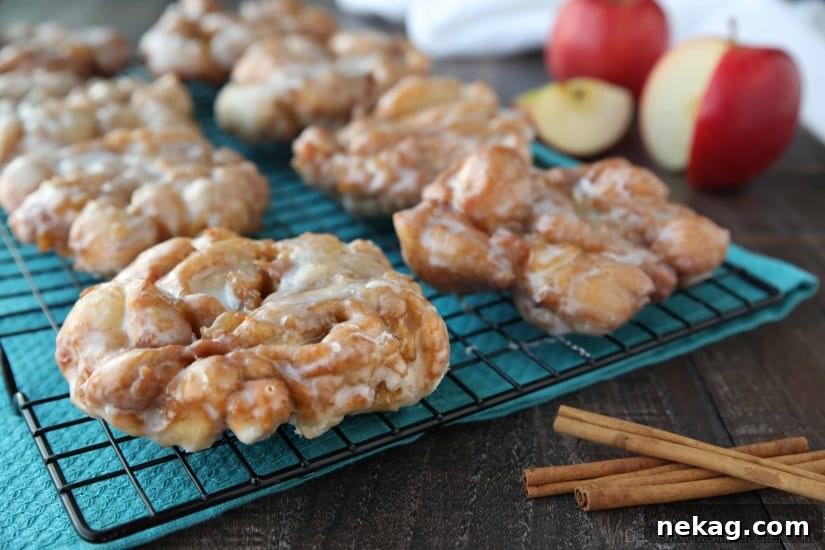 Apple Fritters - an easy and delicious yeast doughnut with chunks of apples, ground cinnamon, and a sweet glaze.