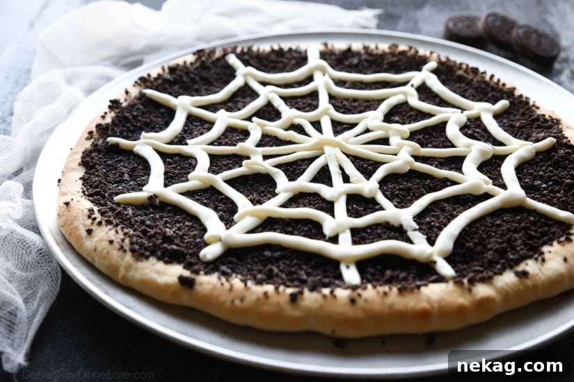 This Cobweb Oreo Dessert Pizza is an easy and fun Halloween party food that will be enjoyed by guests of all ages.