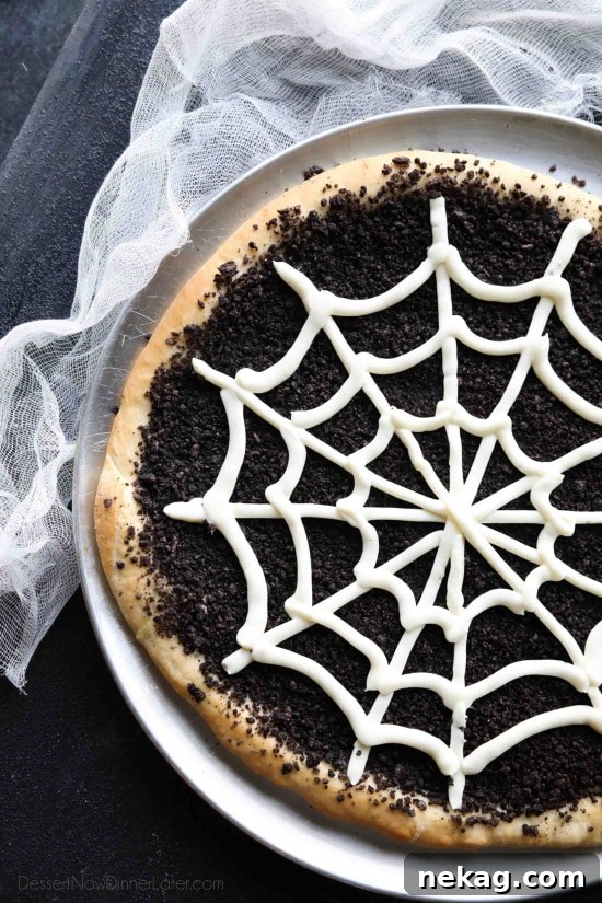 This Cobweb Oreo Dessert Pizza is an easy and fun Halloween party food that will be enjoyed by guests of all ages.