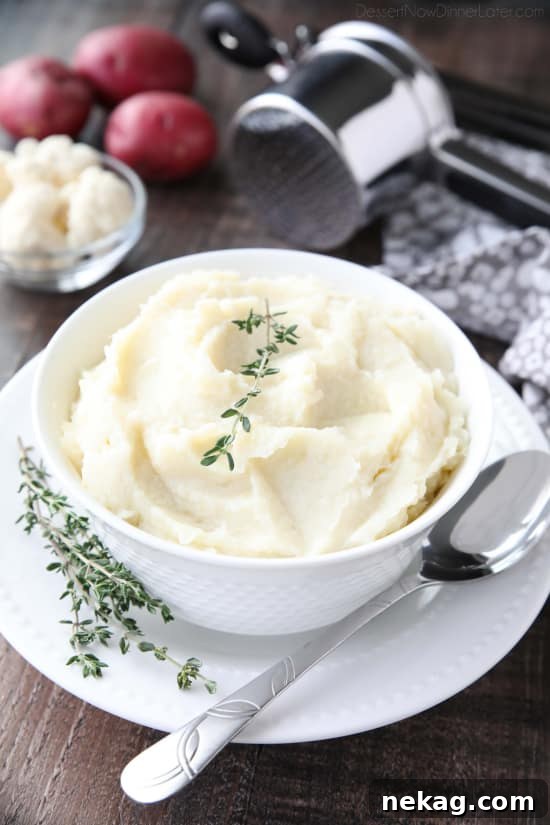 Lightened-up Creamy Cauliflower and Mashed Potatoes is a healthier side dish, with half cauliflower and half potatoes. Velvety smooth and creamy with less carbs and no milk, sour cream, or butter. Delicious enough for Thanksgiving or Christmas, yet simple enough for any dinner.
