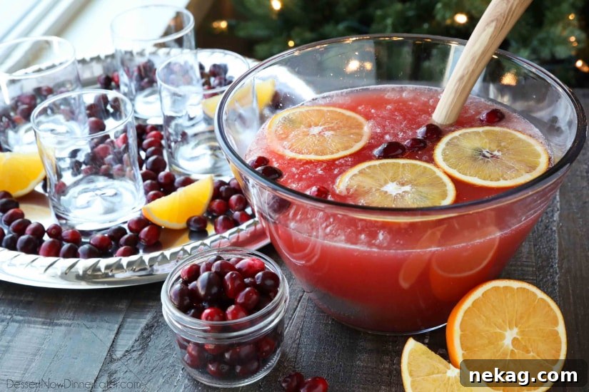 This non-alcoholic Cranberry Orange Mocktail is an easy and refreshing fruit punch drink for the holidays. It's fizzy, fruity, and only 3 ingredients!