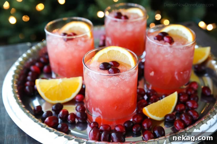 This non-alcoholic Cranberry Orange Mocktail is an easy and refreshing fruit punch drink for the holidays. It's fizzy, fruity, and only 3 ingredients!