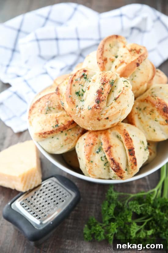 Garlic Parmesan Pull-Apart Dinner Rolls 2 These easy Garlic Parmesan Rolls have layers of flavor to pull apart and savor in every bite. The perfect dinner rolls for holidays or any meal. You'll love these shortcut butterflake rolls.