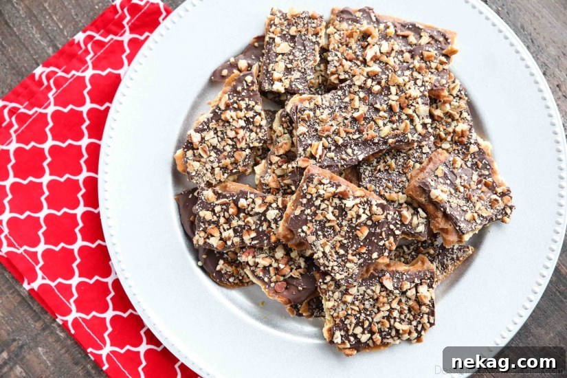 Cracker Toffee (aka Christmas Crack) is so easy to make and highly addictive! Saltine crackers are coated in a quick toffee layer and topped with chocolate and nuts.