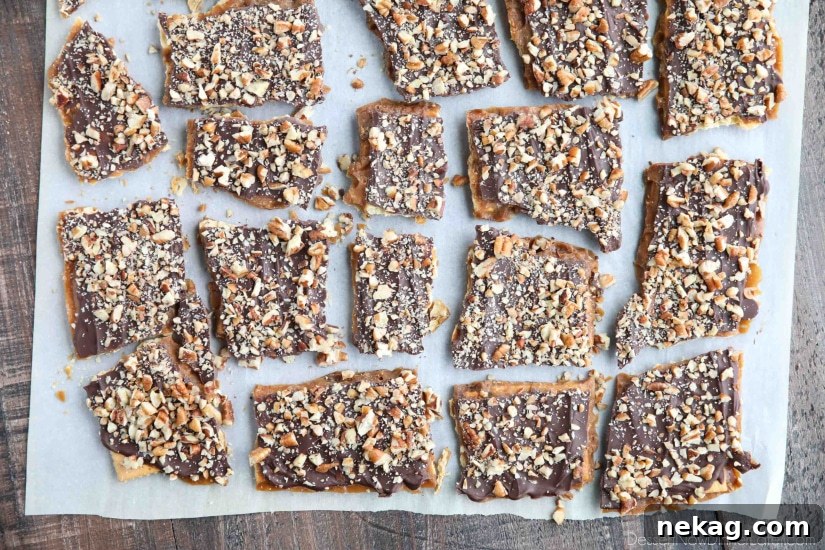 Cracker Toffee (aka Christmas Crack) is so easy to make and highly addictive! Saltine crackers are coated in a quick toffee layer and topped with chocolate and nuts.
