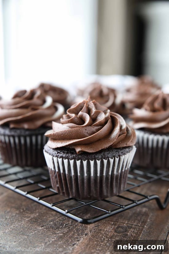 Silky Chocolate Cream Cheese Frosting Recipe (Video) 3 Chocolate Cream Cheese Frosting piped on top of chocolate cupcakes.