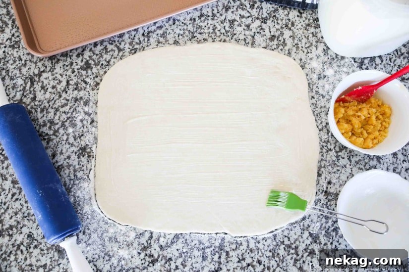 Homemade Orange Rolls with Tangy Glaze 4 Orange Rolls - Roll dough into a rectangle, then brush softened butter on top.