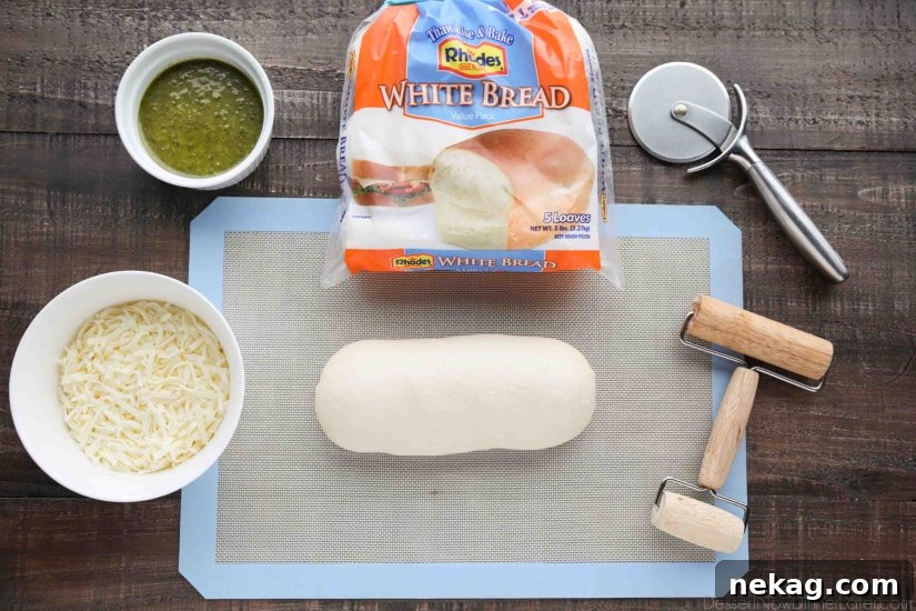 Crispy Pesto Breadsticks Recipe for Garlic-Parmesan Dipping 5 Ingredients for Easy Pesto Breadsticks -- Rhodes White Bread, Pesto, and Shredded Mozzarella.
