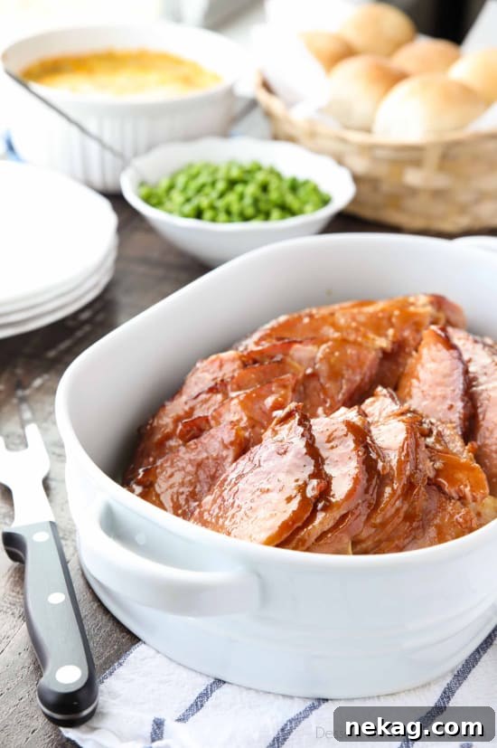 Brown Sugar Mustard Glazed Ham is super easy to make with only a few common ingredients for a thick, sticky glaze. No pre-cooking the glaze. Just mix, slather, and bake. It's the easiest holiday ham!