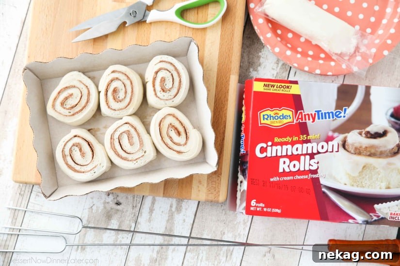 Campfire Cinnamon Rolls are cooked on a stick over a fire or grill. As easy as a can of biscuits, but with real yeast dough instead! The best cinnamon rolls you will ever have while camping!