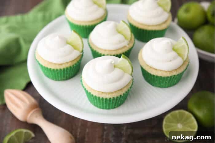 Top view of key lime cupcakes on cake stand.