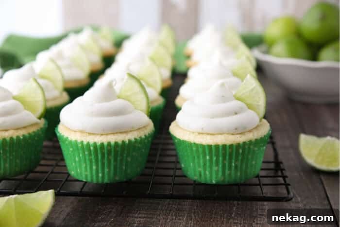 Frosted Key Lime Cupcakes on wire cooling rack.