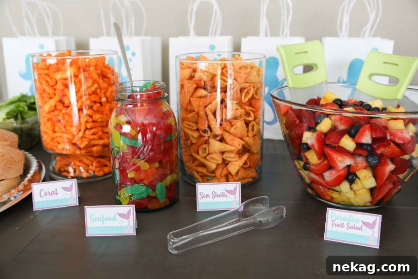 Mermaid Party Food - Coral (Crunchy Cheetos), Seafood (Swedish Fish), Seashells (Bugles), Paradise Fruit Salad (Strawberries, Blueberries, & Pineapple)