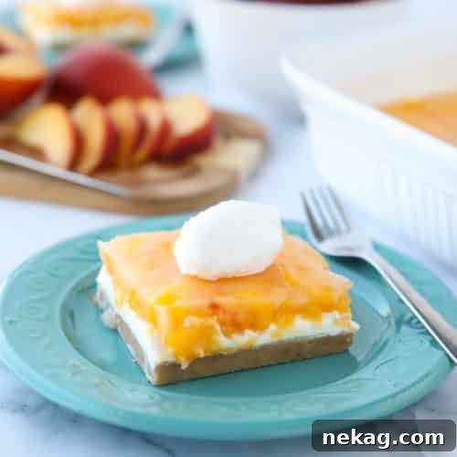 This Peaches and Cream Dessert has a pecan shortbread crust, no-bake cheesecake filling, and fresh peach layer on top. It's a delicious light and fruity summer dessert.