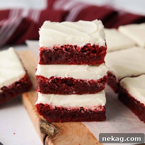 Decadent Red Velvet Brownie Recipe with Cream Cheese Swirl 12 Stack of three Red Velvet Brownies with cream cheese frosting.