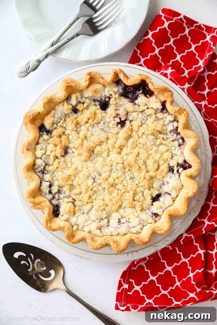 Cherry Crumb Pie can be made with fresh or frozen cherries, flavored with a hint of almond extract, and topped with a sweet crumble topping. Easy and delicious!