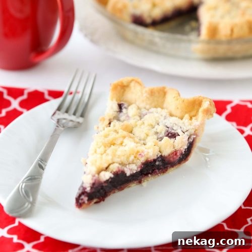 Cherry Crumb Pie can be made with fresh or frozen cherries, flavored with a hint of almond extract, and topped with a sweet crumble topping. Easy and delicious!