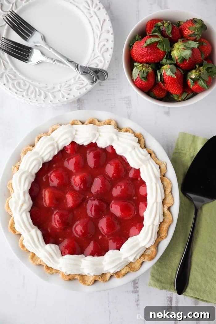 Strawberry Cream Pie - layers of pie crust, no-bake cheesecake, strawberries, glaze, and whipped cream.
