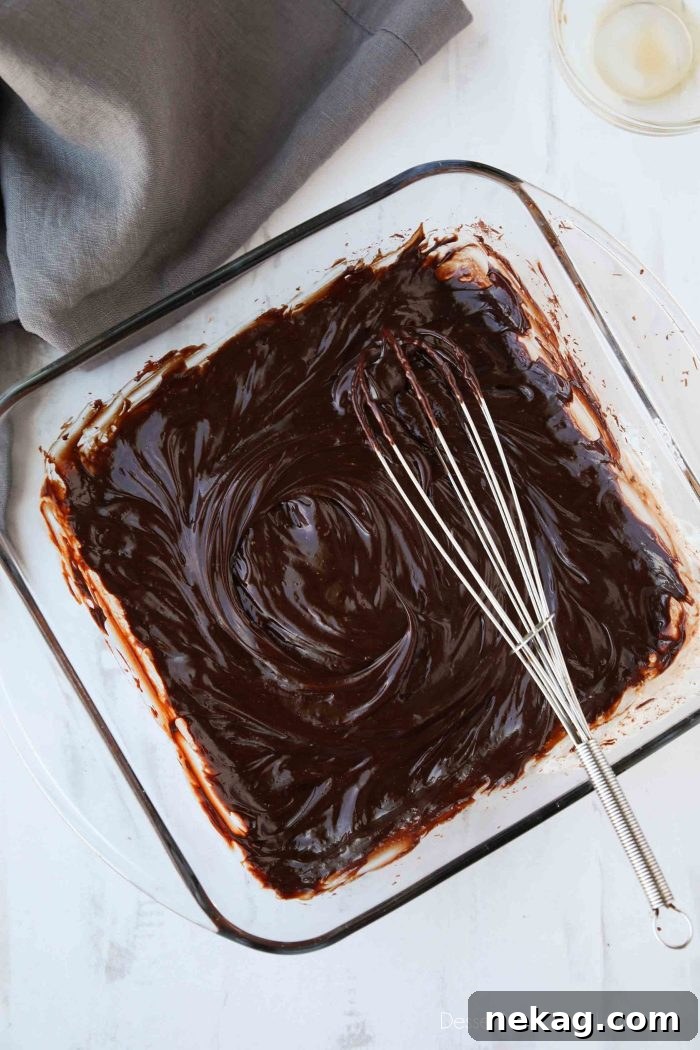Decadent Chocolate Truffle Recipe: Homemade Rich Truffles in Minutes 6 Chopped chocolate and hot cream is whisked together with vanilla for extra flavor.