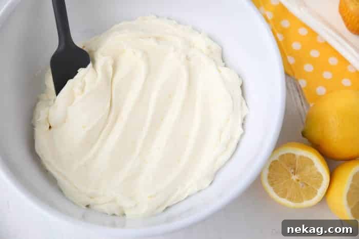 Lemon Cream Cheese Frosting is light and creamy with fresh lemon flavor. It's slightly tangy and not overly sweet. Perfect for piping or decorating cupcakes and cakes.
