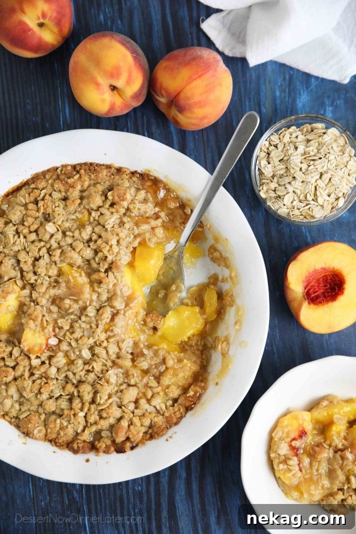 Fresh peach crisp made with a buttery brown sugar and cinnamon oat topping.