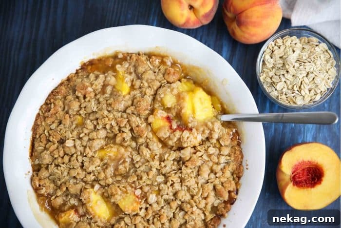 Peach Crisp (aka Peach Crumble) has saucy peaches and a crunchy streusel topping.