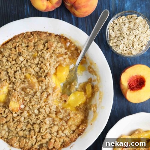 Fresh peach crisp made with a buttery brown sugar and cinnamon oat topping.