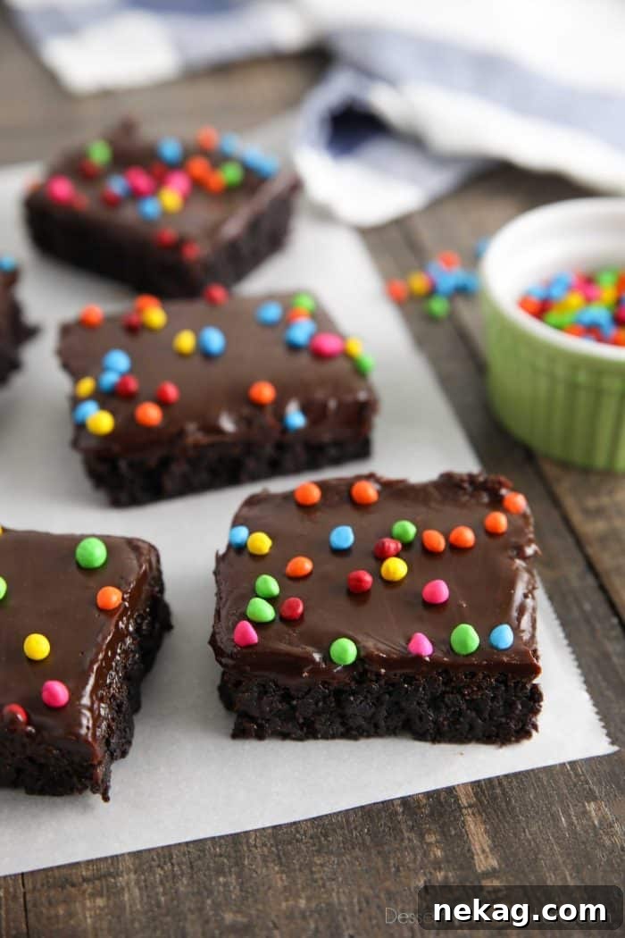 Chewy Chocolate Brownies with Rainbow Sprinkles 2 These homemade cosmic brownies are even better than store-bought! Rich, fudgy brownies are topped with a creamy chocolate ganache and candy coated chocolate chips. They're easy to make from scratch and not just for lunchbox treats!
