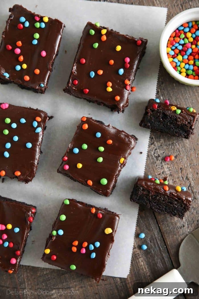 Chewy Chocolate Brownies with Rainbow Sprinkles 3 Copycat Little Debbie Cosmic Brownies - Fudgy homemade brownies topped with chocolate ganache and rainbow coated chocolate chips.