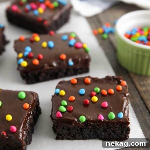 Chewy Chocolate Brownies with Rainbow Sprinkles 8 These homemade cosmic brownies are even better than store-bought! Rich, fudgy brownies are topped with a creamy chocolate ganache and candy coated chocolate chips. They're easy to make from scratch and not just for lunchbox treats!