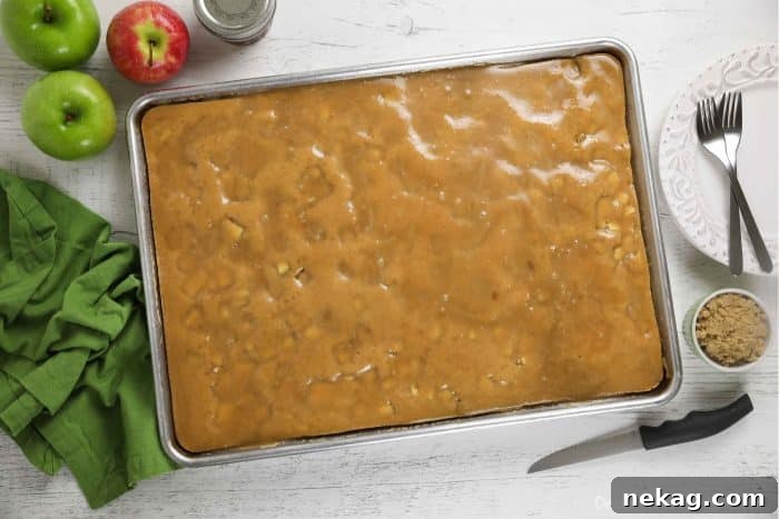 Brown Sugar Glazed Apple Sheet Cake Recipe 8 Freshly glazed apple sheet cake in a pan.