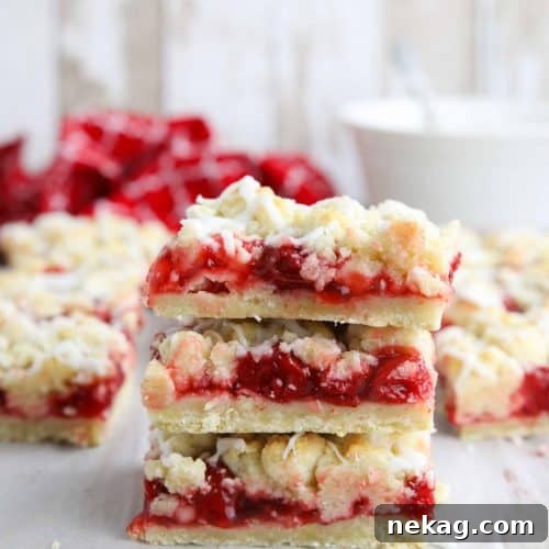 Three cherry pie bars stacked on top of each other.
