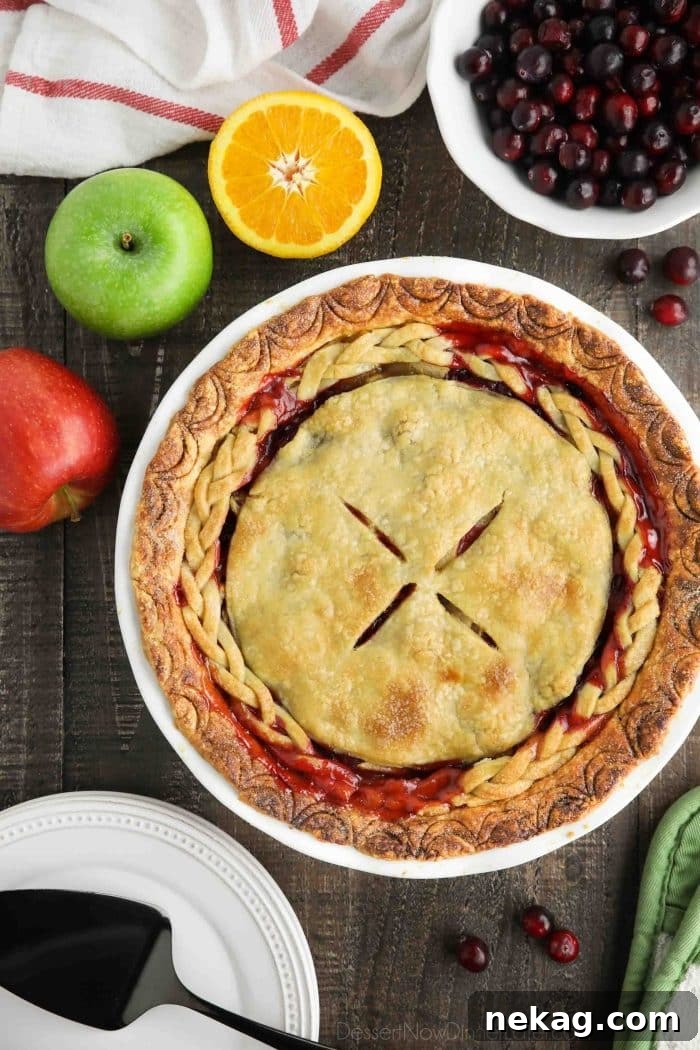 Cranberry Apple Pie Recipe: Tart-Sweet Holiday Dessert 3 A whole apple cranberry pie with braided crust.