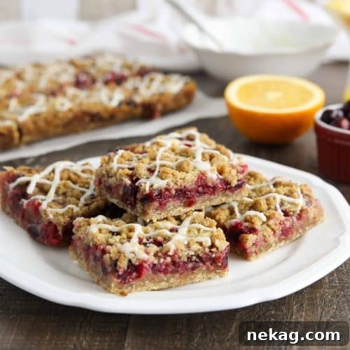 Plate of glazed cranberry crumb bars.