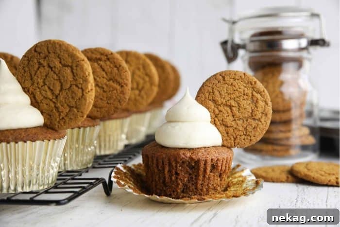 Gingerbread Cupcakes Recipe: Spiced Frosting and Holiday Tips 6 Spiced gingerbread cupcake with cream cheese frosting and a gingersnap cookie on top.